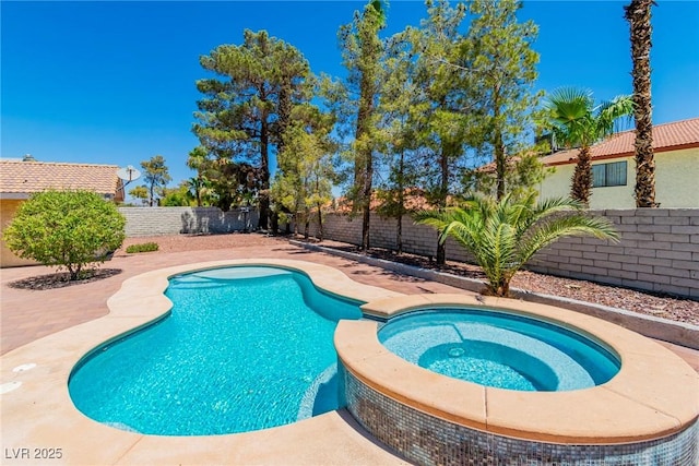 view of pool featuring an in ground hot tub