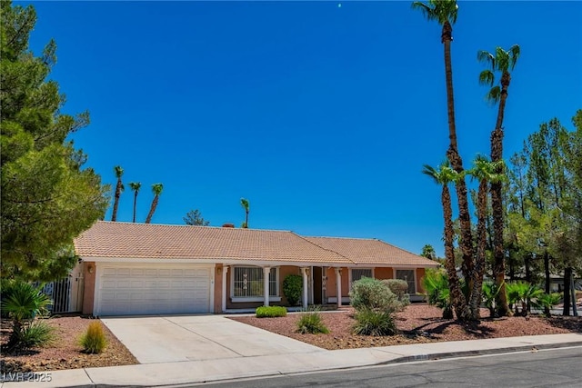 ranch-style house featuring a garage