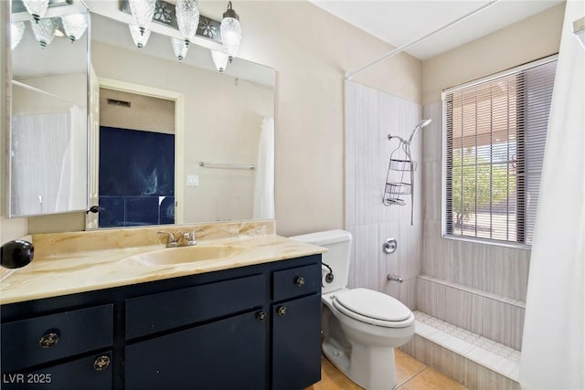 bathroom featuring vanity, a shower with shower curtain, tile patterned floors, and toilet