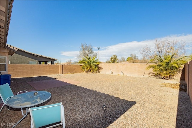 view of yard with a patio and a fenced backyard