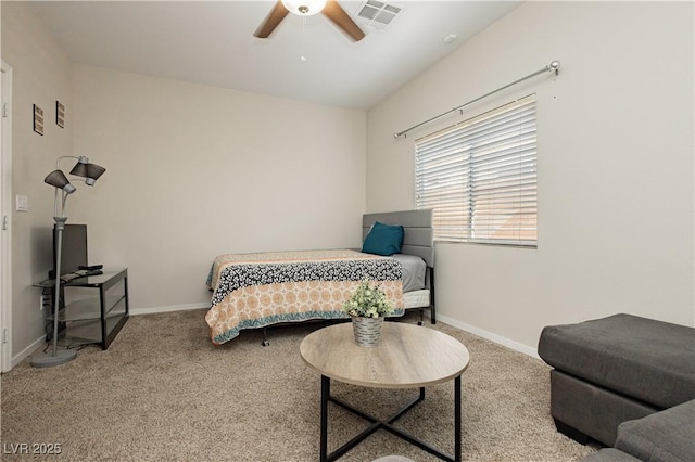 carpeted bedroom featuring ceiling fan, visible vents, and baseboards