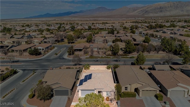 birds eye view of property featuring a mountain view