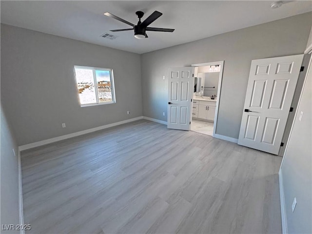 unfurnished bedroom with visible vents, light wood-style flooring, a ceiling fan, connected bathroom, and baseboards