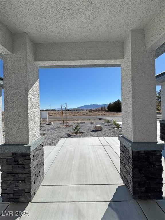 view of patio with a mountain view