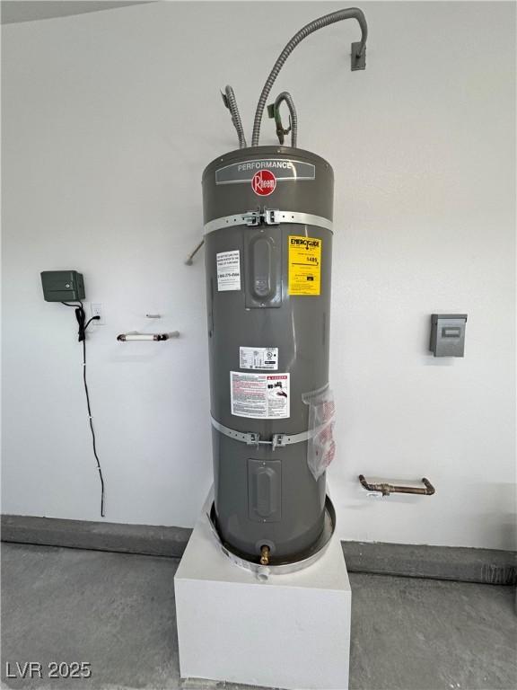 utility room featuring secured water heater