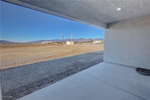 view of patio with a mountain view