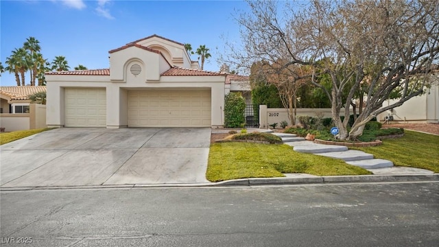 mediterranean / spanish-style home with a garage