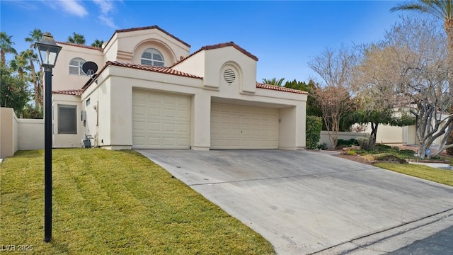 mediterranean / spanish home featuring a garage and a front yard