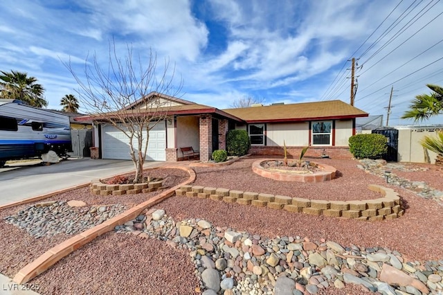 ranch-style house featuring a garage