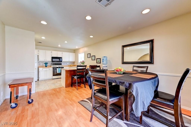 dining room with light wood-type flooring