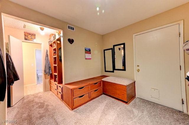 foyer entrance with light carpet