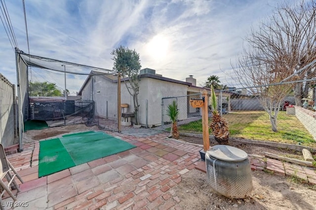 view of patio featuring a jacuzzi