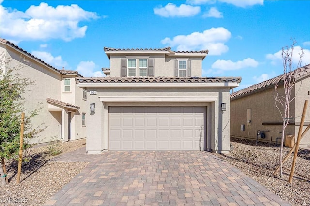 mediterranean / spanish house featuring a garage