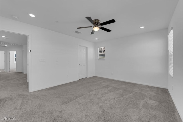 carpeted empty room with ceiling fan