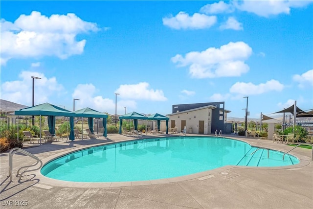 view of swimming pool with a gazebo and a patio area