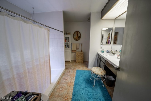 bathroom with vanity and walk in shower