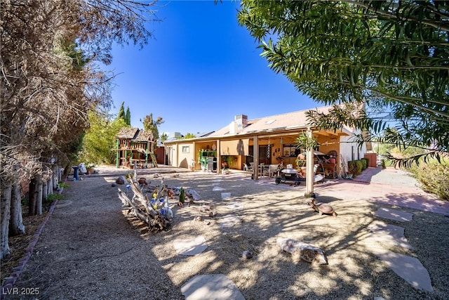 rear view of house featuring a patio area