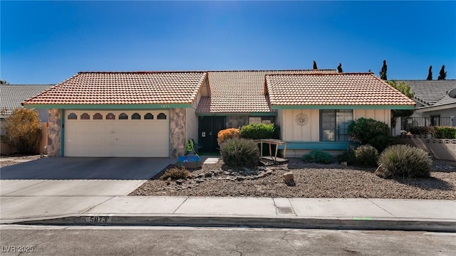 ranch-style home featuring a garage