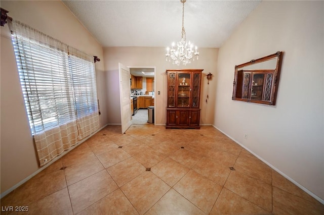 unfurnished dining area with lofted ceiling, light tile patterned floors, and a chandelier