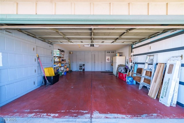 garage featuring white refrigerator