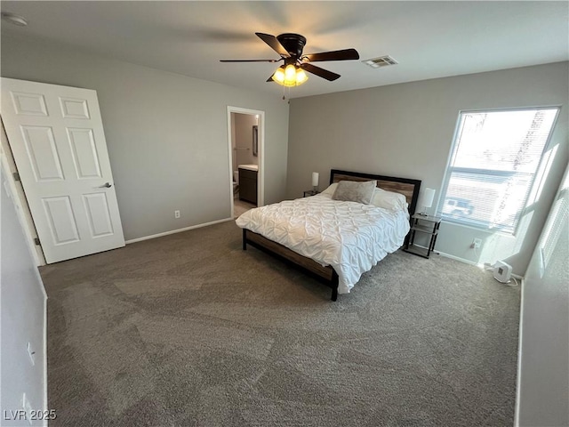 carpeted bedroom featuring connected bathroom and ceiling fan