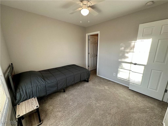 bedroom with baseboards, a ceiling fan, and carpet flooring