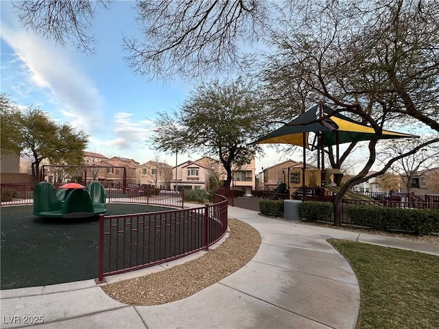 view of community with a residential view, fence, and playground community