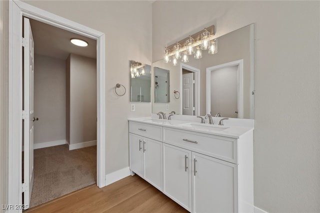 bathroom featuring vanity and wood-type flooring