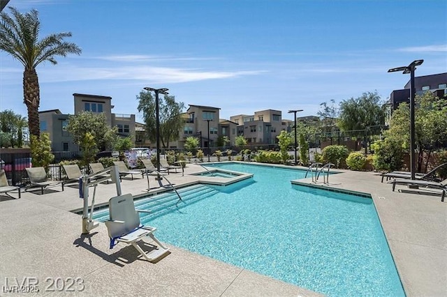 view of swimming pool featuring a patio area