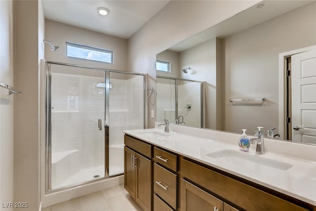 bathroom with tile patterned floors, vanity, and an enclosed shower