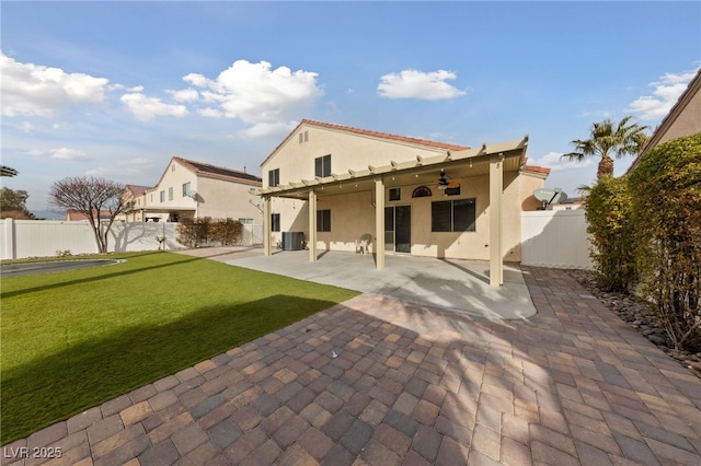 rear view of property with central AC, a lawn, ceiling fan, and a patio area