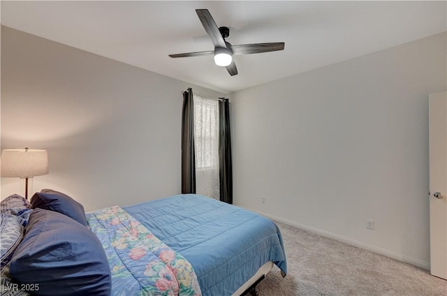 bedroom featuring ceiling fan and light colored carpet