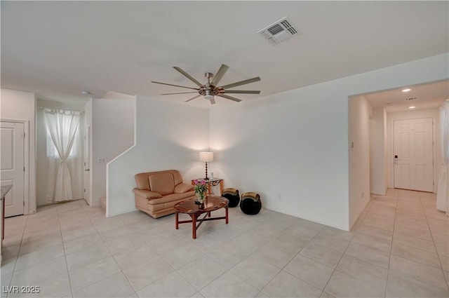 sitting room with light tile patterned floors and ceiling fan