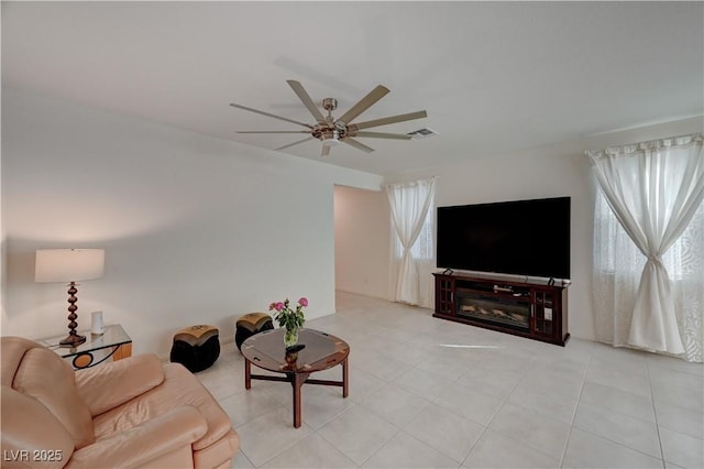 living room with plenty of natural light and ceiling fan