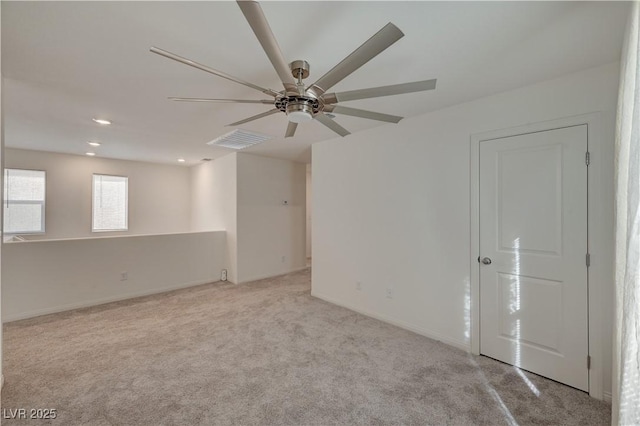 carpeted empty room with ceiling fan