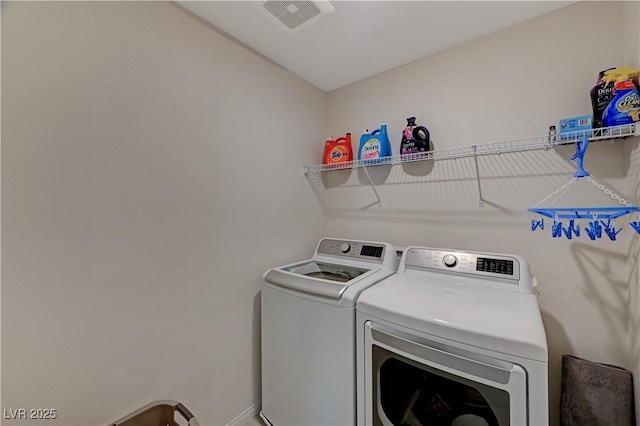 laundry room featuring washer and clothes dryer