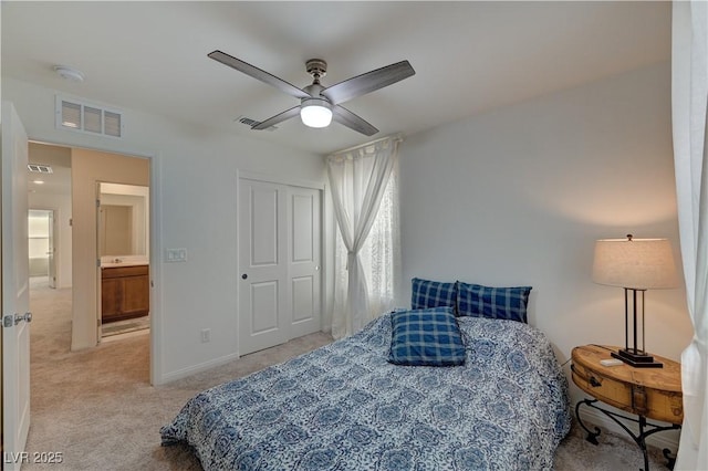 bedroom with light carpet and ceiling fan