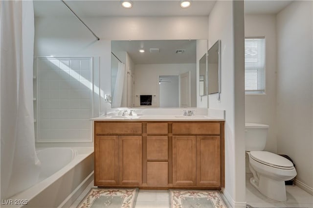 full bathroom featuring vanity, shower / bath combination with curtain, tile patterned floors, and toilet