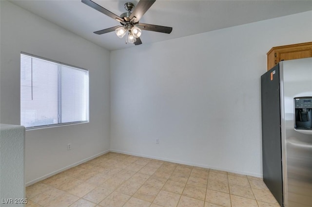 spare room with ceiling fan