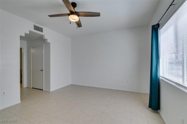 unfurnished room with ceiling fan