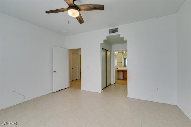 unfurnished room with ceiling fan