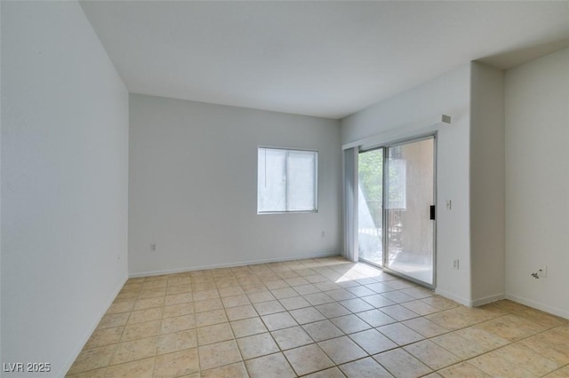 view of tiled spare room