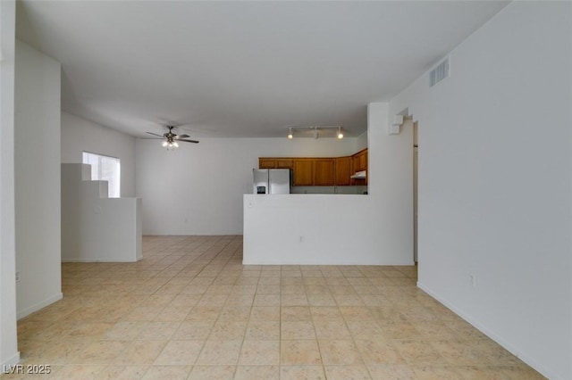 unfurnished living room with ceiling fan