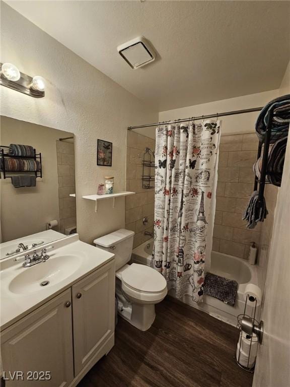 full bathroom with shower / bath combination with curtain, vanity, toilet, and hardwood / wood-style floors