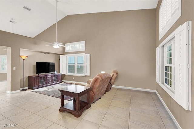 living room featuring light tile patterned floors, high vaulted ceiling, and ceiling fan