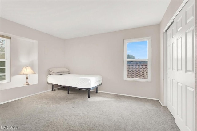 carpeted bedroom with a closet