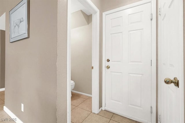 bathroom featuring tile patterned floors and toilet