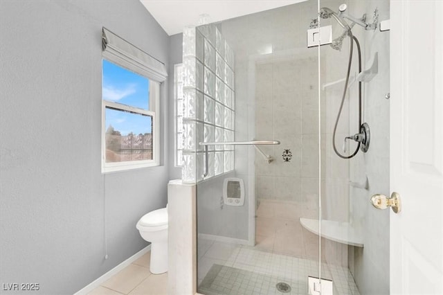 bathroom with an enclosed shower, tile patterned floors, and toilet