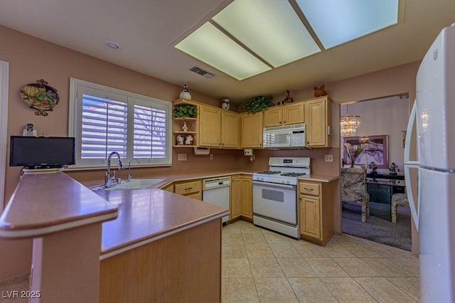 kitchen featuring light tile patterned floors, light brown cabinets, white appliances, a sink, and light countertops