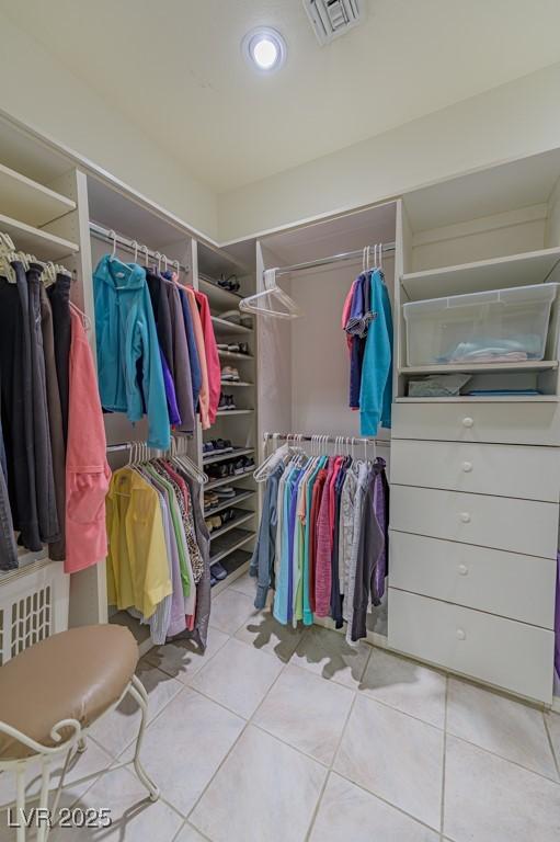 walk in closet featuring visible vents and tile patterned floors